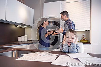 Sad child suffering and parents having discussion Stock Photo