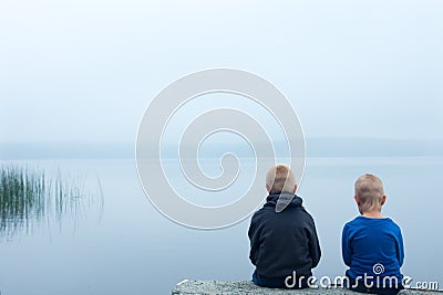 Sad children in a foggy day Stock Photo