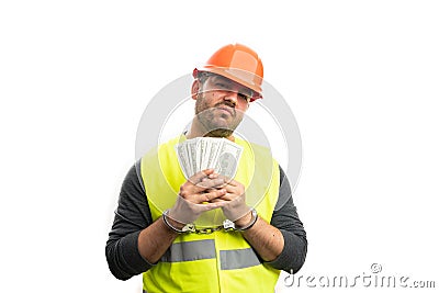 Sad corrupted constructor arrested showing stolen money Stock Photo