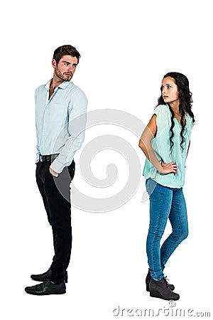 Sad couple standing back to back Stock Photo