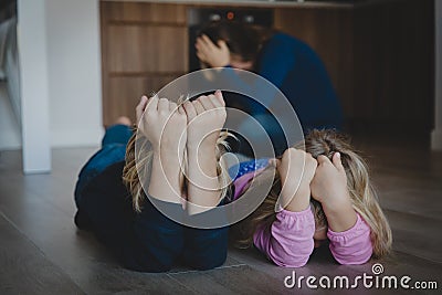 Sad crying bored kids, tired and exhausted mother Stock Photo