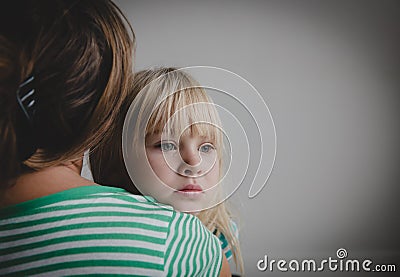 Sad crying little girl hugging mother, parenting Stock Photo