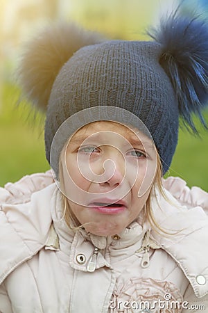 Sad crying offended girl cold autumn outdoor. Concept of upset child Stock Photo