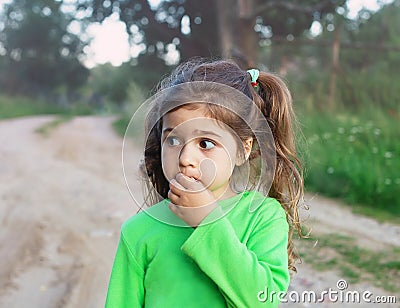 Sad cute little girl looking sad and afraid Stock Photo