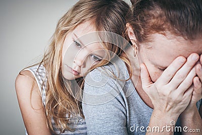 Sad daughter hugging his mother Stock Photo