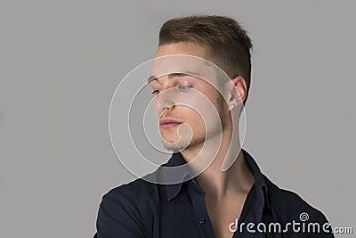 Sad, depressed blond young man Stock Photo