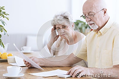 Sad elderly marriage with documents Stock Photo