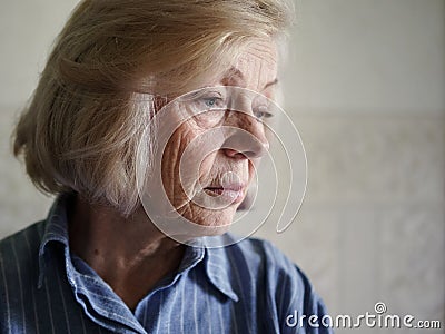 Sad elderly woman Stock Photo