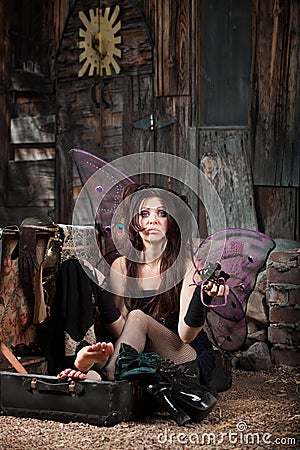 Sad Fairy In Suitcase Stock Photo