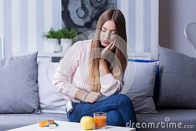 Sad female with hypoglycemia Stock Photo