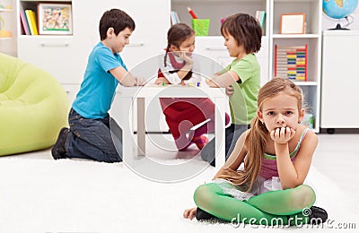 Sad girl feeling excluded from the group Stock Photo