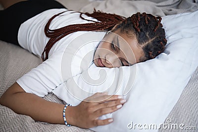 Sad girl, mental health problem and bedroom rest with depressed thoughts and personality disorder. Hopeless young woman Stock Photo