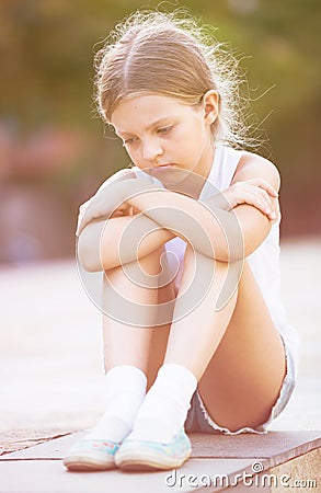 Sad girl outdoors Stock Photo