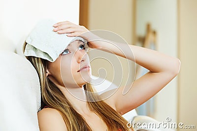 Sad girl suffering of hangover headache Stock Photo