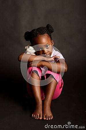 Sad little African girl Stock Photo