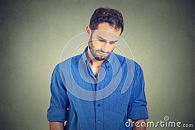 Sad lonely man looking down has no energy motivation in life depressed Stock Photo