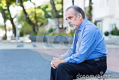 Sad and lonely retired businessman Stock Photo