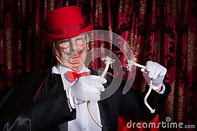 Sad magician with trick gone wrong Stock Photo