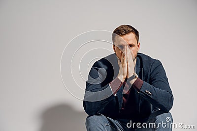 Sad man fell depression and stressed on white background. Emotional male Stock Photo