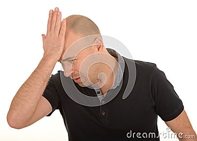 Sad man with hand on head Stock Photo