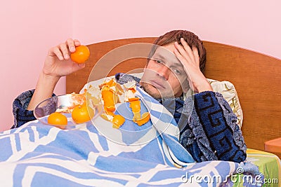Sad man mandarins gorged itself looks in frame Stock Photo