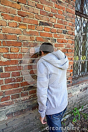 Sad Man by the Wall Stock Photo