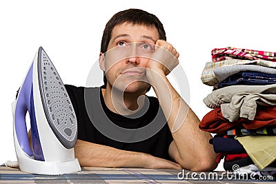 Sad man, wash clothing and iron Stock Photo