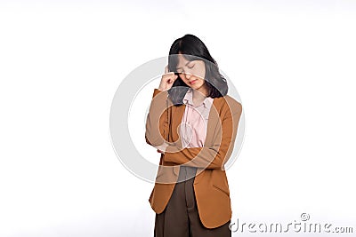 Sad office girl, asian woman sulking and frowning disappointed, standing upset and distressed against white background Stock Photo