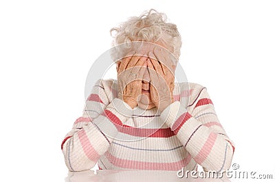 Sad Old Women with her hands to her face is dismay Stock Photo
