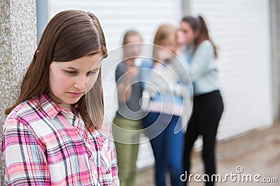 Sad Pre Teen Girl Feeling Left Out By Friends Stock Photo