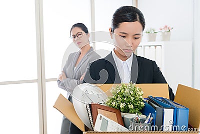 Sad pretty office worker girl losing company job Stock Photo