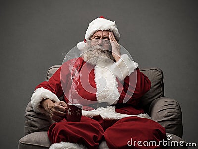 Santa Claus is having an headache Stock Photo