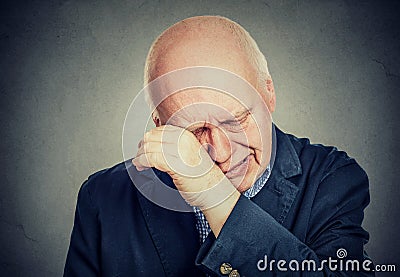 Sad senior man lonely grandfather, depressed crying Stock Photo