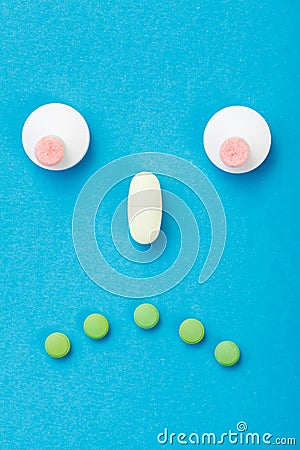 Sad smileyface made of pills Stock Photo