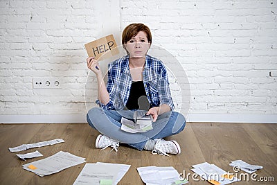 Sad stressed woman with calculator and bank and bills paperwork and documents doing domestic financial accounting Stock Photo