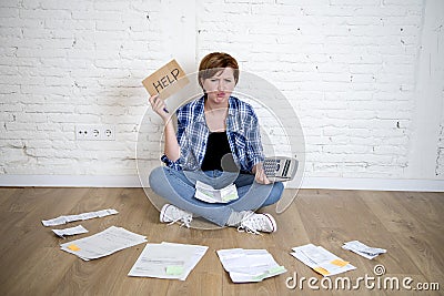 Sad stressed woman with calculator and bank and bills paperwork and documents doing domestic financial accounting Stock Photo