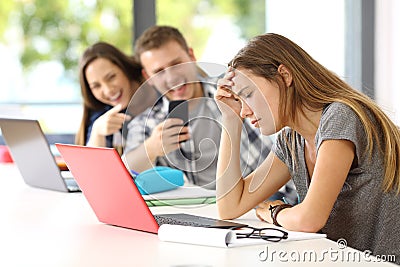 Sad student victim of cyber bullying Stock Photo