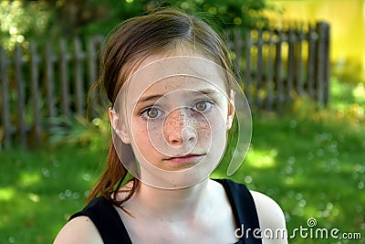 Sad teenage girl with eyes wide open and a disappointed look on your face Stock Photo