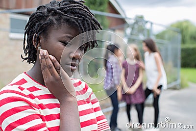 Sad Teenage Girl Feeling Left Out By Friends Stock Photo