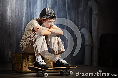 Sad teenager sitting Stock Photo