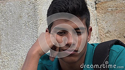 Sad And Unhappy Male Hispanic Teen Stock Photo