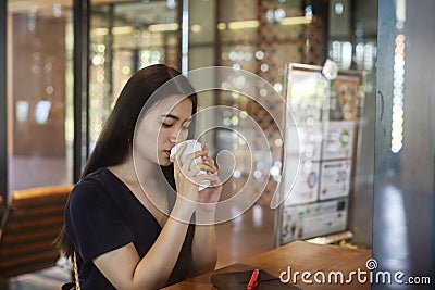 Sad woman drink hot coffee Stock Photo