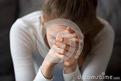 Sad woman feeling hopeless crying alone, girl in despair concept Stock Photo