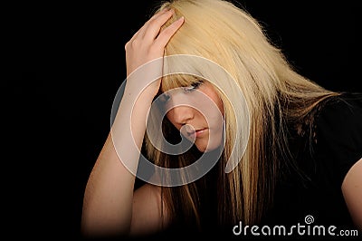 Sad woman holding head Stock Photo
