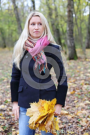 Sad woman with maple leaflets Stock Photo