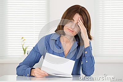 Sad Woman Reading Document Stock Photo