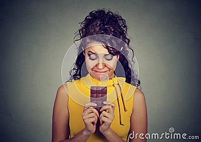 Sad woman tired of diet restrictions craving sweets chocolate bar Stock Photo