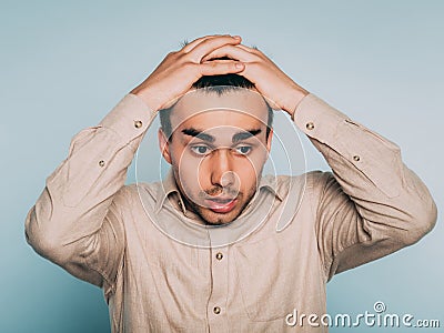 Sad worried scared afraid man pull hair out emotion Stock Photo