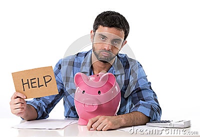 Sad worried man in stress with piggy bank in bad financial situation Stock Photo