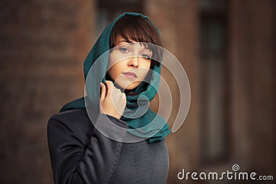 Sad young fashion woman in grey classic coat Stock Photo